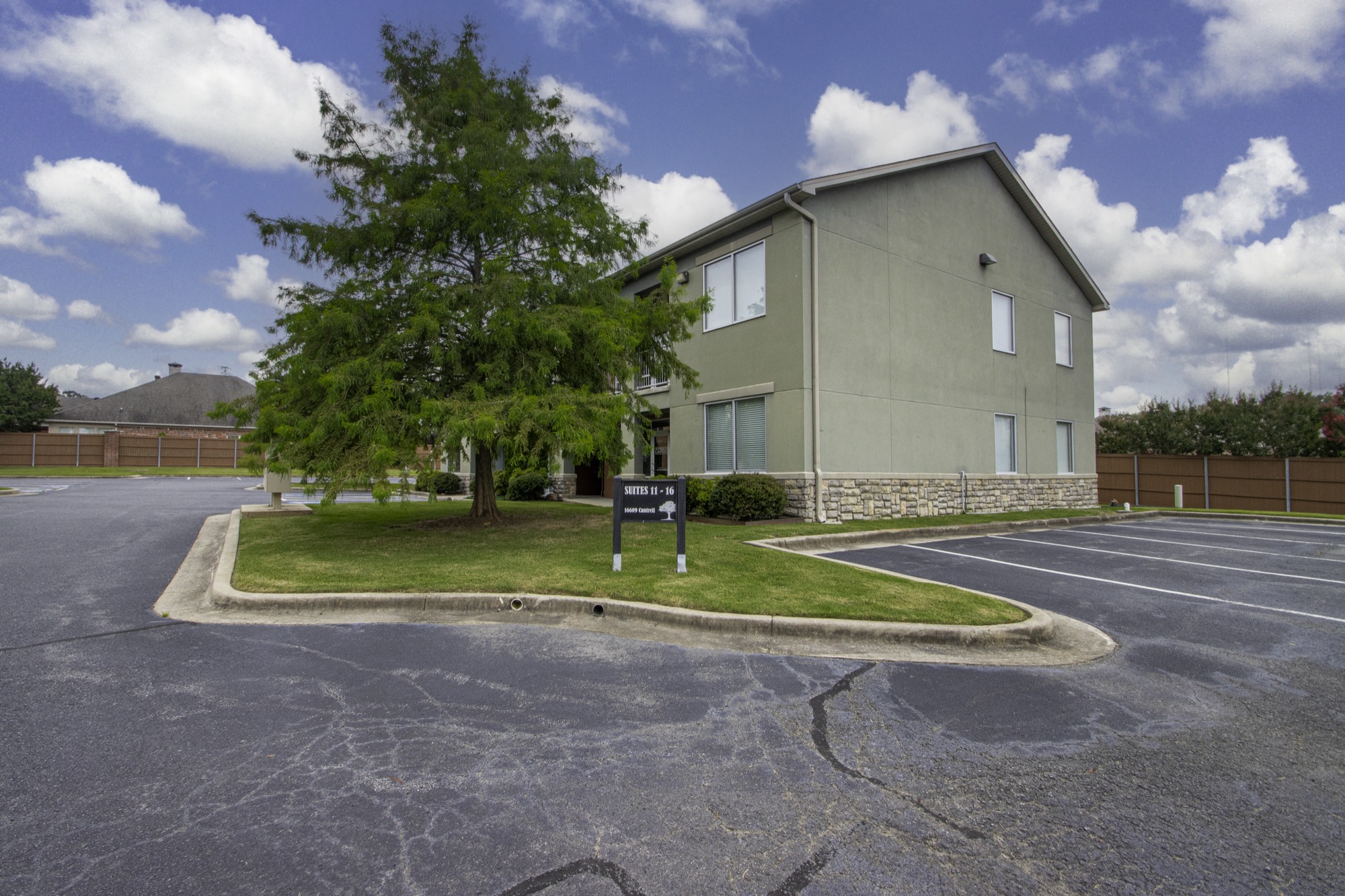 Office building surrounded by mature trees at Highway 10 Office Park