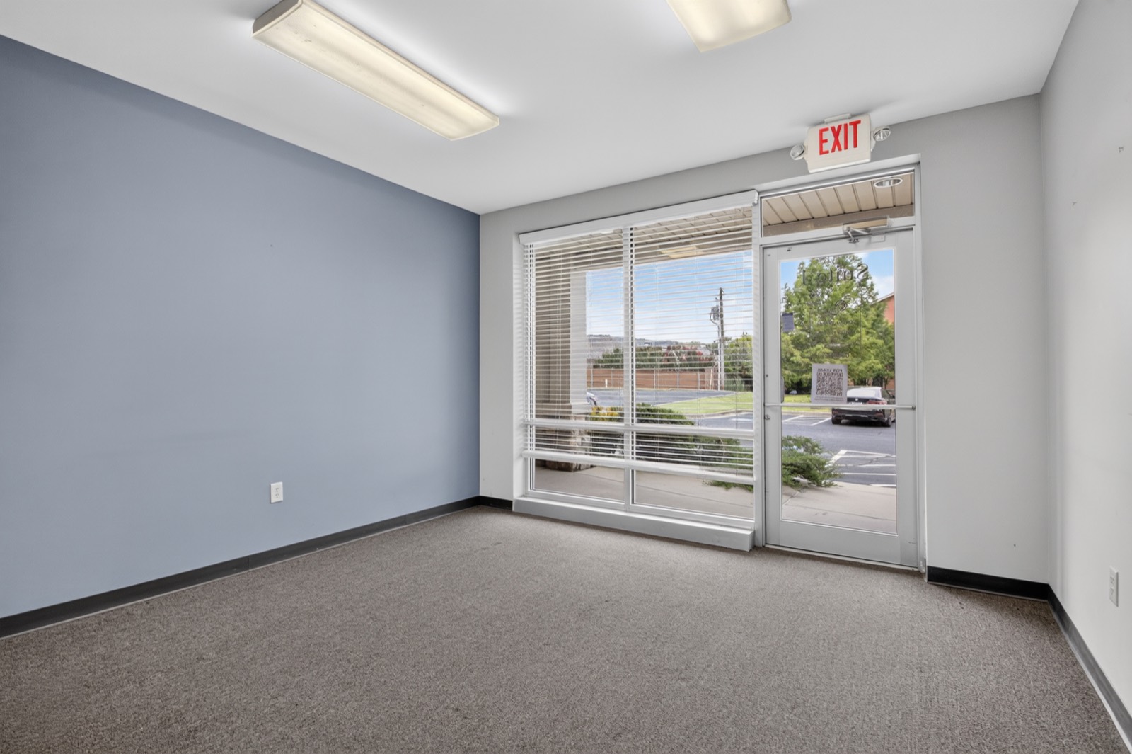 Office suite with accent wall and glass entry at Highway 10 Office Park
